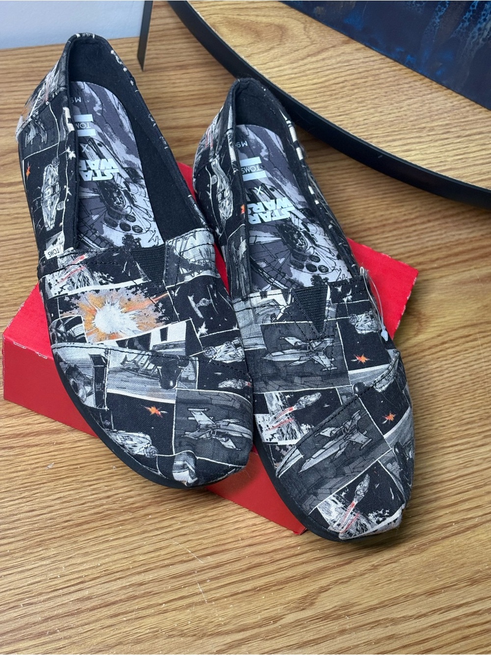 Toms Uni-Sex Star Wars Graphic Slip-On Loafers - Black with Orange Accents